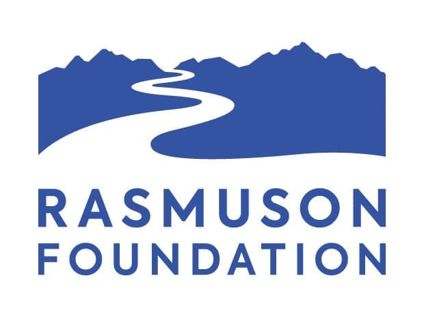 Rasmuson Foundation logo - The name of the foundation underneath a white winding road or river disappearing into a mountain range.